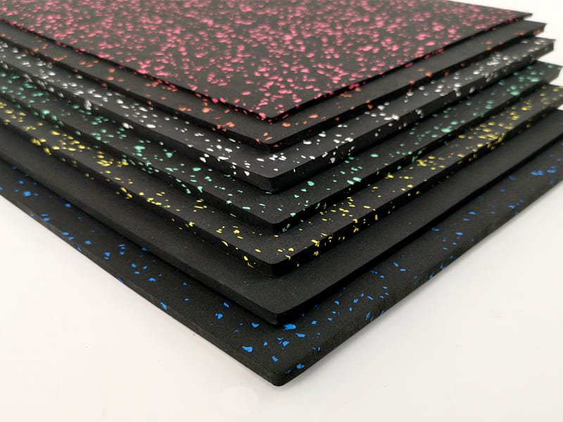 Architect and engineer examining gym flooring samples against blueprints